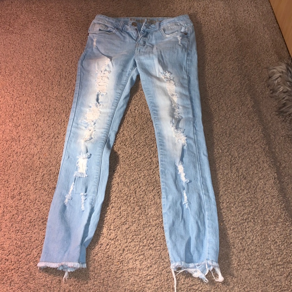 Light blue ripped jeans.